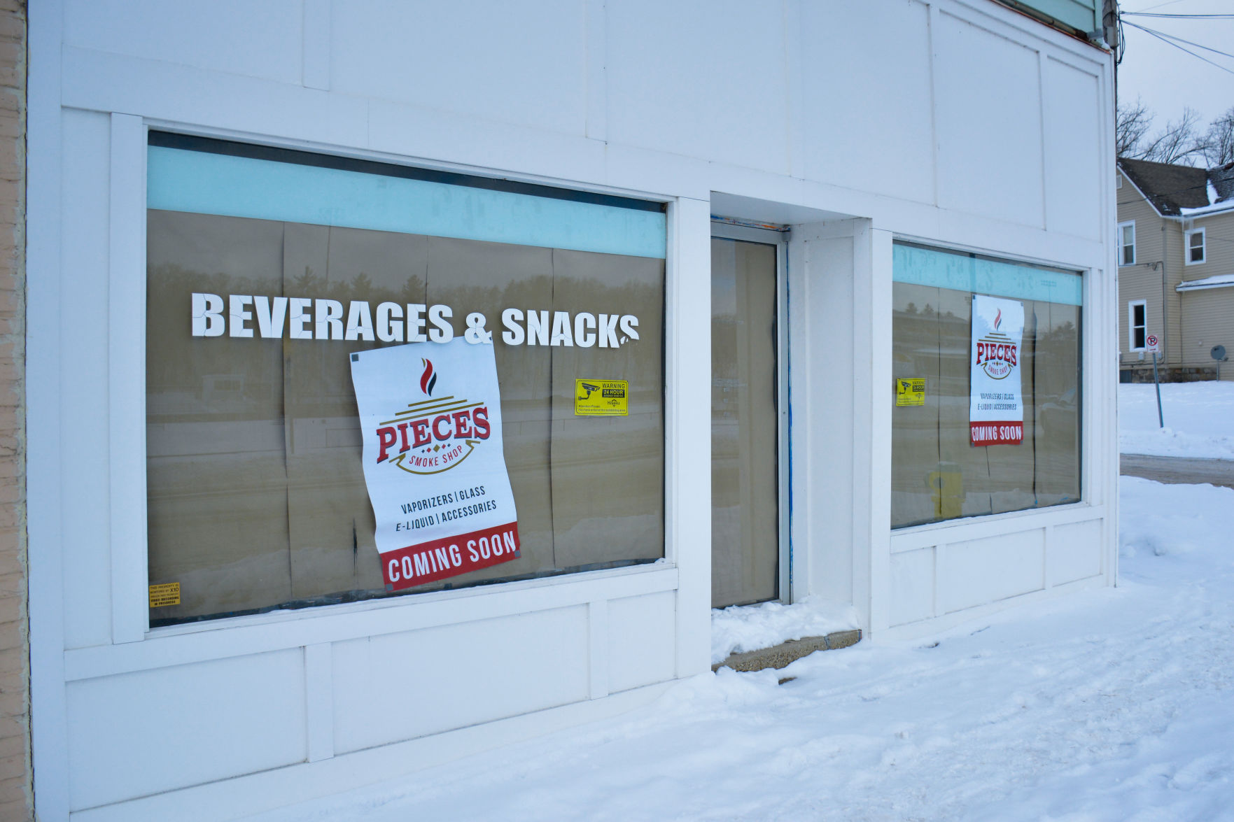 A coming soon sign in the window at 1504 W. Michigan Ave, the future site of Pieces Smoke Shop